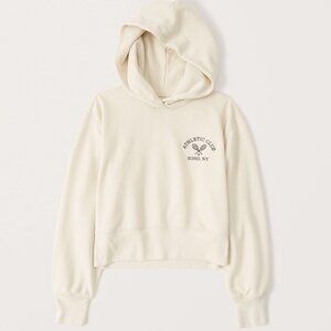 abercrombie cream cropped hoodie featuring “athletic club soho, ny”